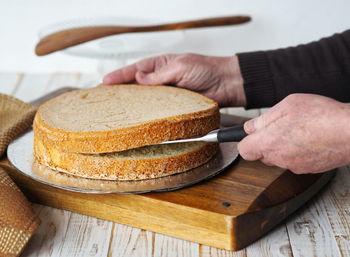 Close-up of person preparing food on cutting board