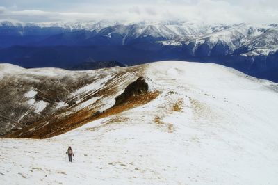 Scenic view of snowcapped mountains against sky