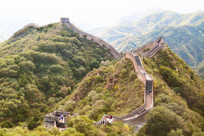Aerial view of people at great wall of china on mountain
