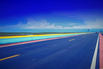 Blurred motion of road against blue sky