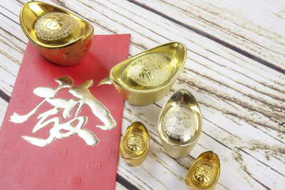 High angle view of coins on table