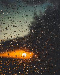 Full frame shot of wet glass window during rainy season