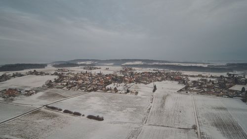 High angle view of road by buildings in city