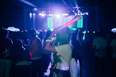 People enjoying music concert