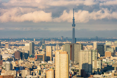 Modern buildings in city against sky