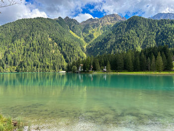 Scenic view of lake and mountains against sky