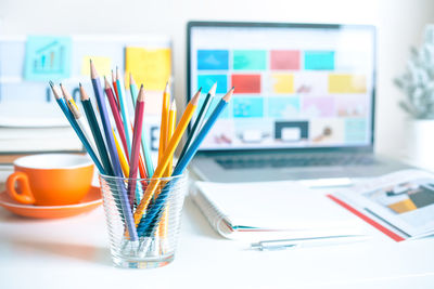 Close-up of colored pencils on table