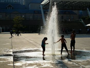 Woman jumping in water