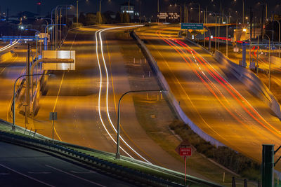 High angle view of light trails on road at night