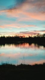 Scenic view of lake at sunset