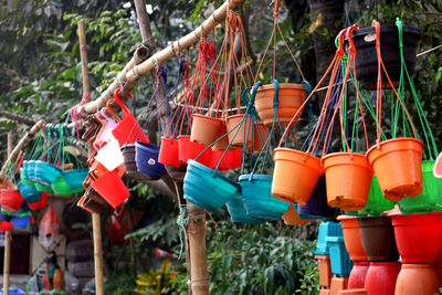 Close-up of multi colored hanging for sale at market stall