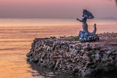 Scenic view of sea at sunset