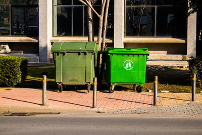 Rear view of man sitting on street