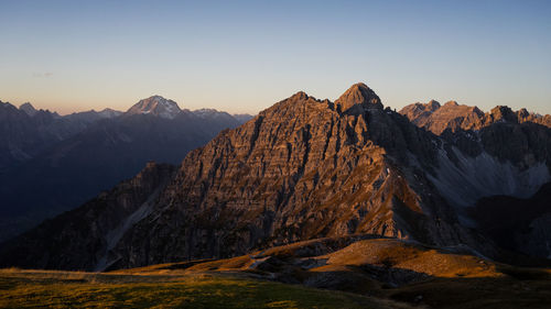 Scenic view of snowcapped mountains against clear sky