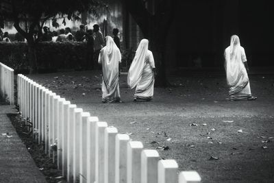 Rear view of friends against blurred background