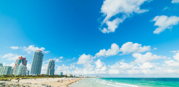 Panoramic view of sea and buildings against sky