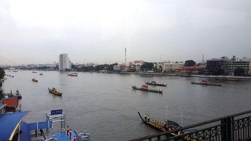 High angle view of river in city against sky