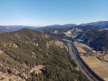 High angle view of mountains against clear sky