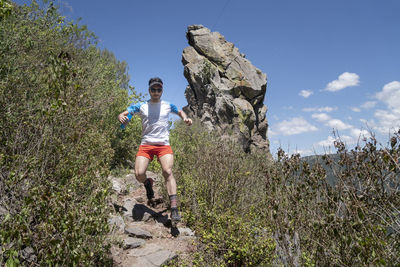 One man running on a trail descending from peña del aire