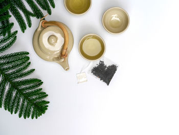 High angle view of tea on table against white background