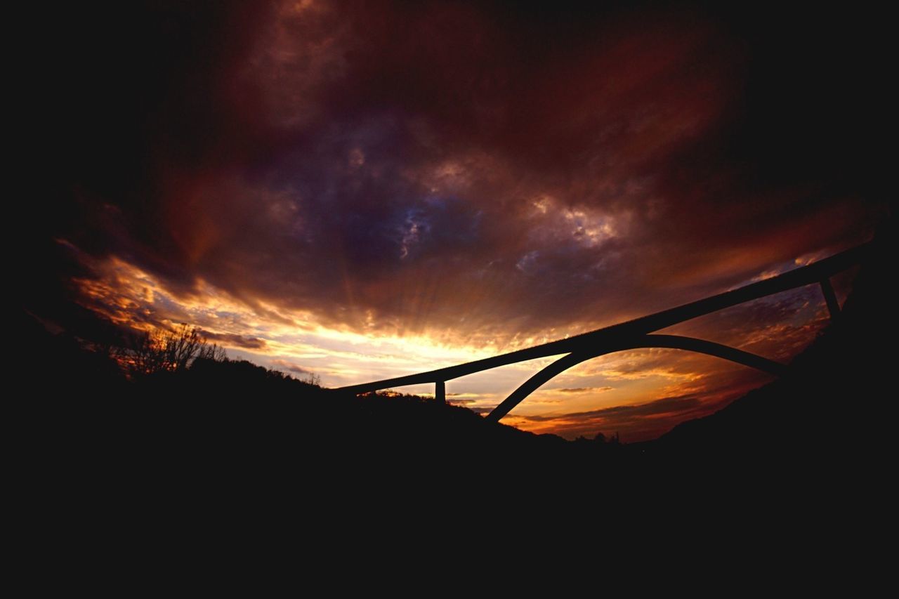 sunset, sky, silhouette, orange color, cloud - sky, beauty in nature, scenics, tranquility, dramatic sky, tranquil scene, nature, dark, idyllic, cloudy, cloud, atmospheric mood, low angle view, landscape, dusk, no people