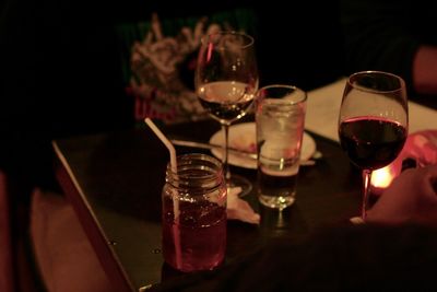 Close-up of wine glasses on table