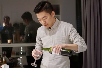 Full length of young man standing in glass