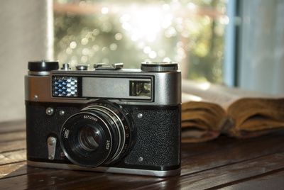 Close-up of camera on table