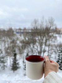 On a cold winter day, a cup of hot drink will warm you up.  view from the balcony.