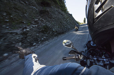 Man riding bicycle on road