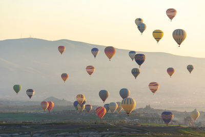 Multi colored hot air balloons flying in sky