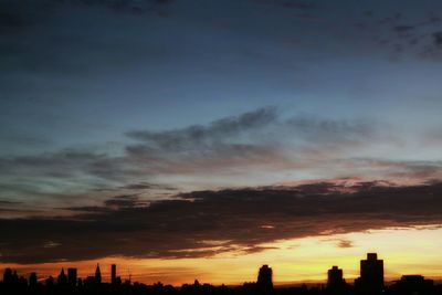 Silhouette of building at sunset