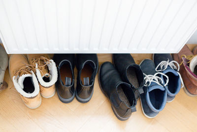 High angle view of shoes on wooden floor