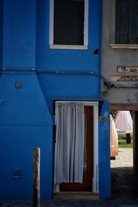 Blue closed door of window