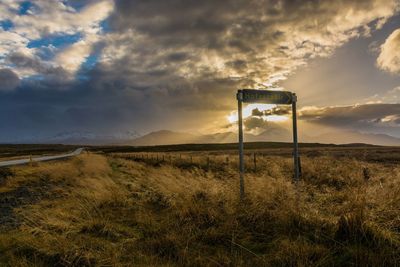 Scenic view of field against sky during sunset