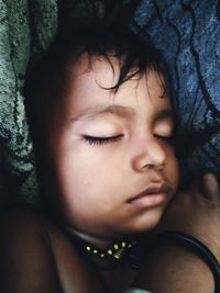 Close-up portrait of cute girl sleeping