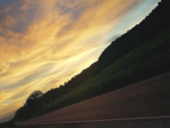 Scenic view of landscape against sky at sunset