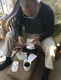 High angle view of man sitting at table