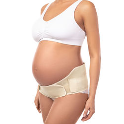Midsection of woman standing against white background