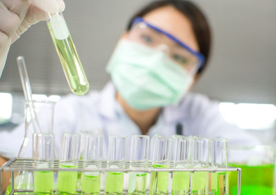 Close-up of woman working in laboratory