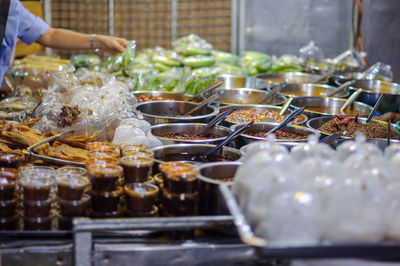 Man preparing food at market stall