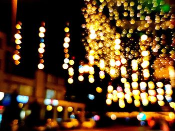 Low angle view of illuminated lights at night