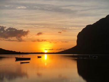 Scenic view of lake against sky during sunset