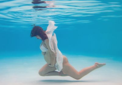 Woman swimming in sea