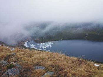 Scenic view of lake and mountains against sky