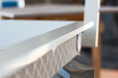 Close-up of railing by fence