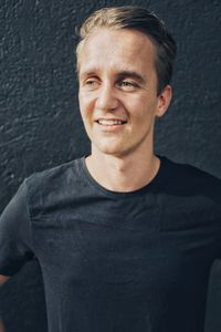 Portrait of young man standing outdoors