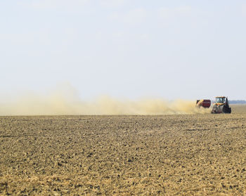 Scenic view of agricultural field against clear sky