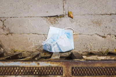 Directly above shot of surgical mask on floor
