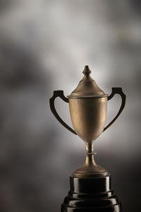 Close-up of trophy on against black background